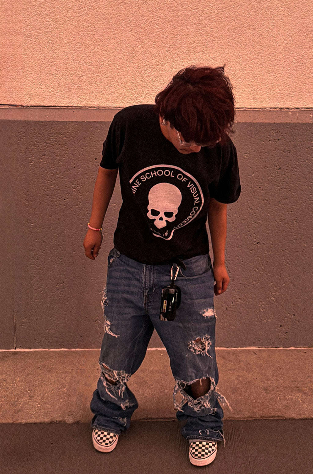 Distressed blue denim jeans with a baggy